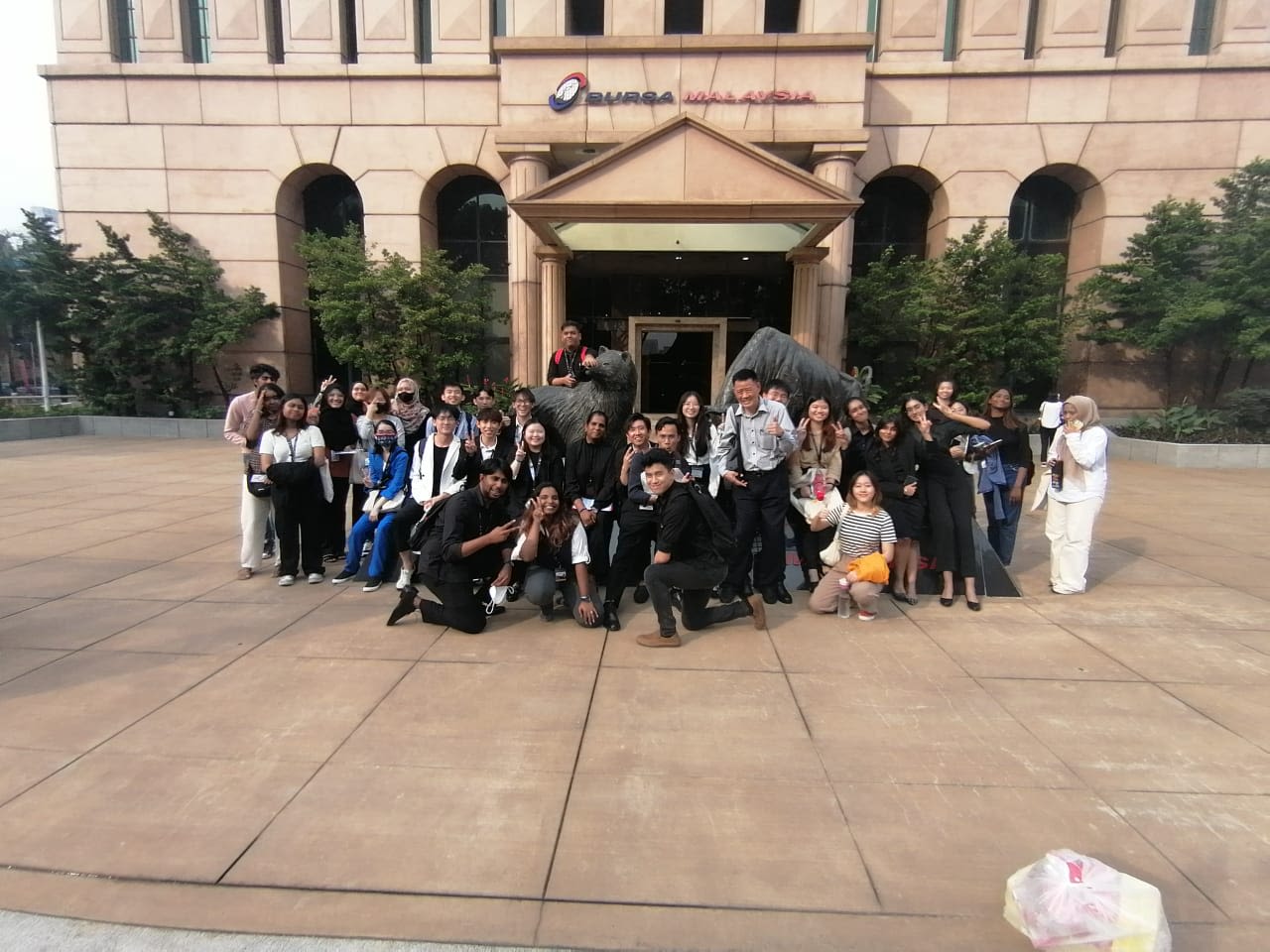 a woman sitting at a table using a laptop