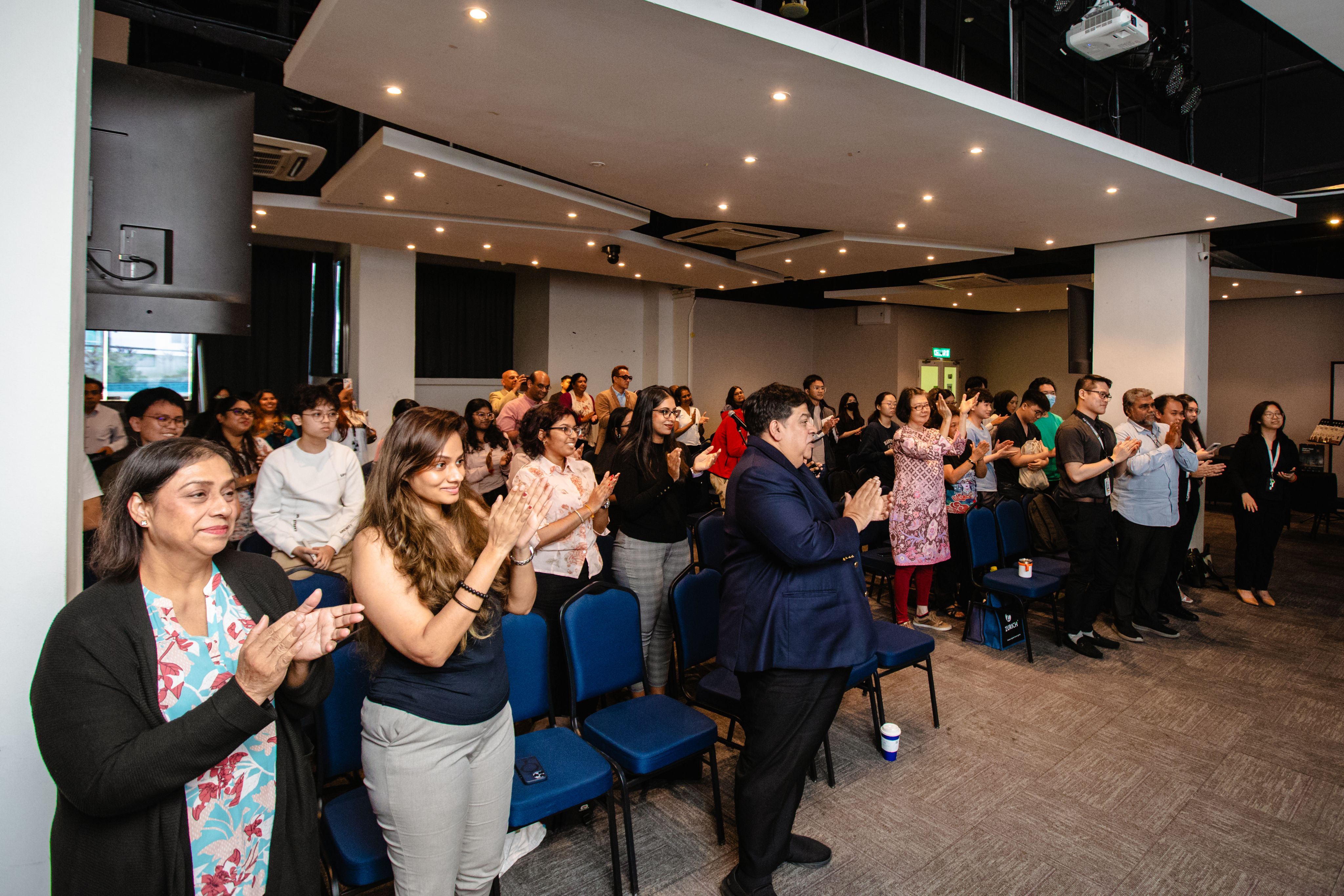 Tan Sri Dato' V.C. George receives a standing ovation.