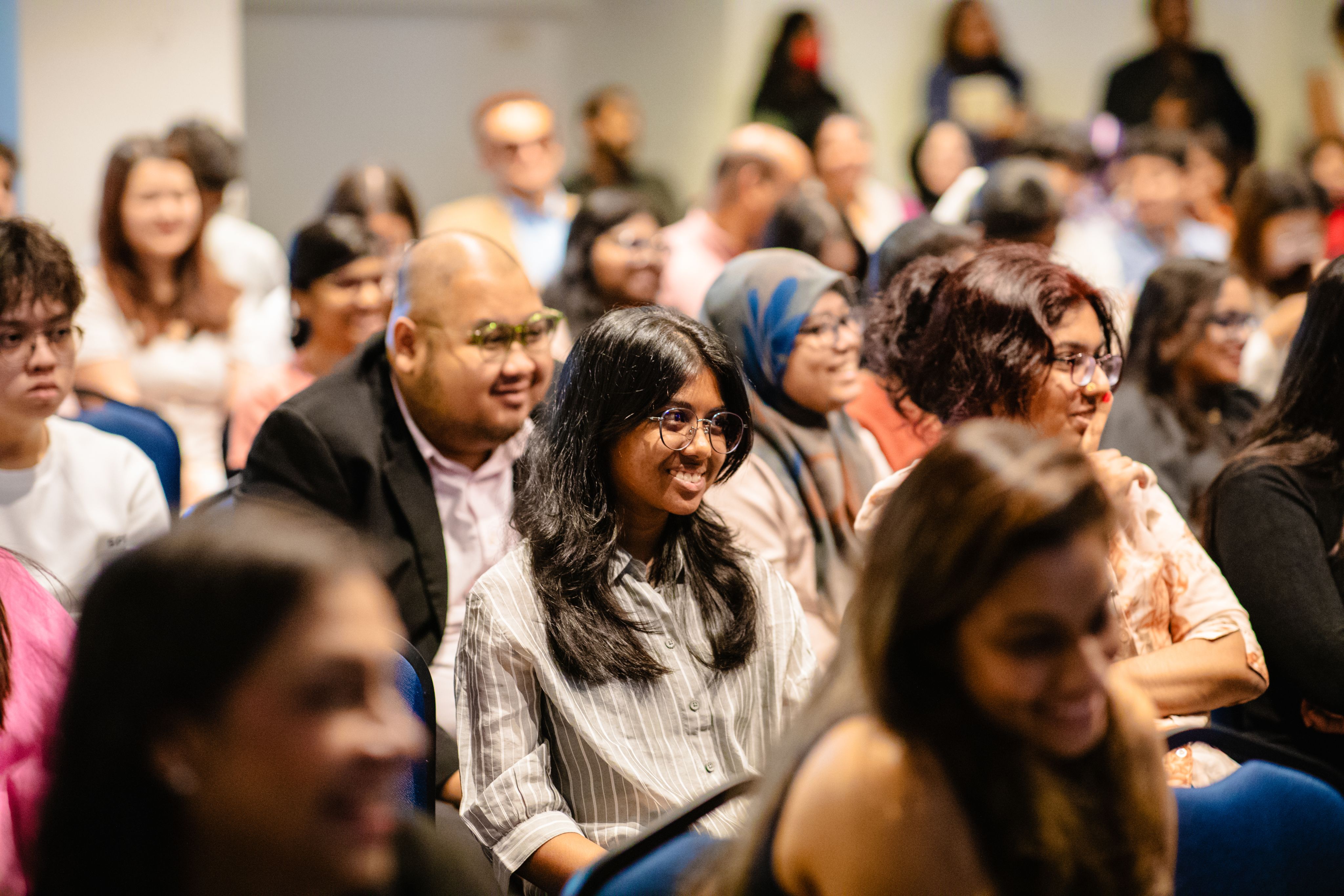 The audience is spellbound by one of Tan Sri Dato' V.C. George's many anecdotes.