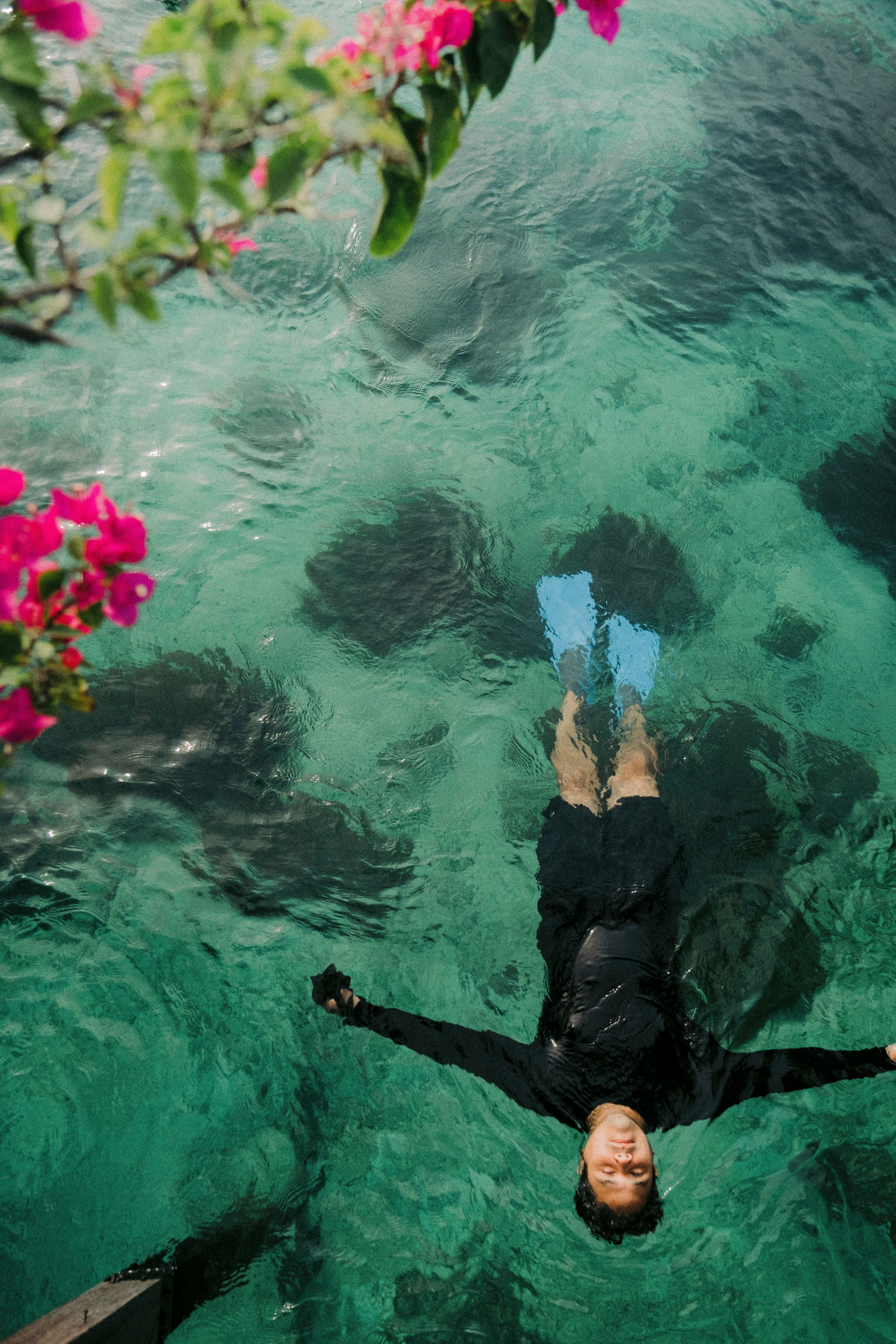 a person floating in a body of water