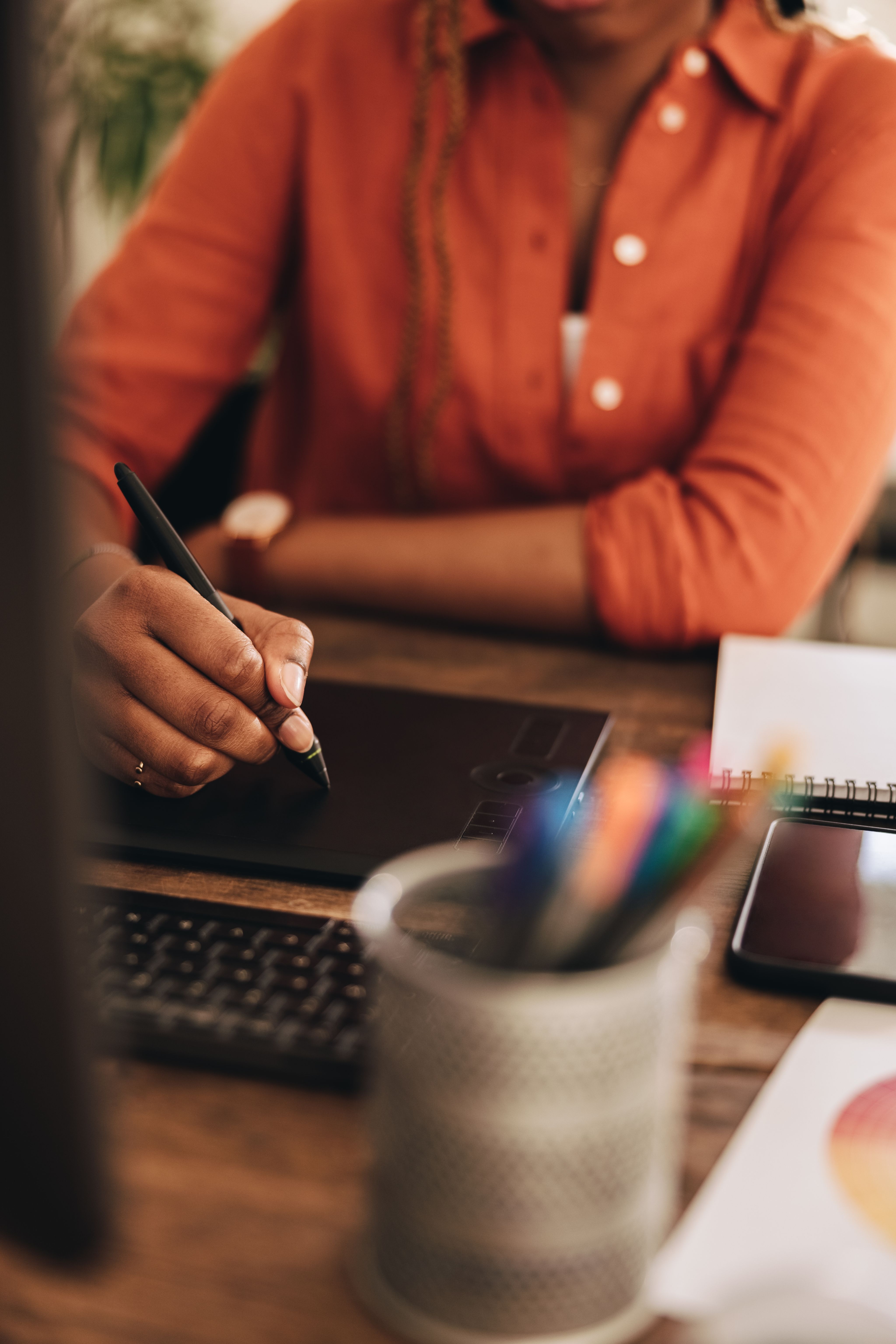 woman walking on street surrounded by buildings