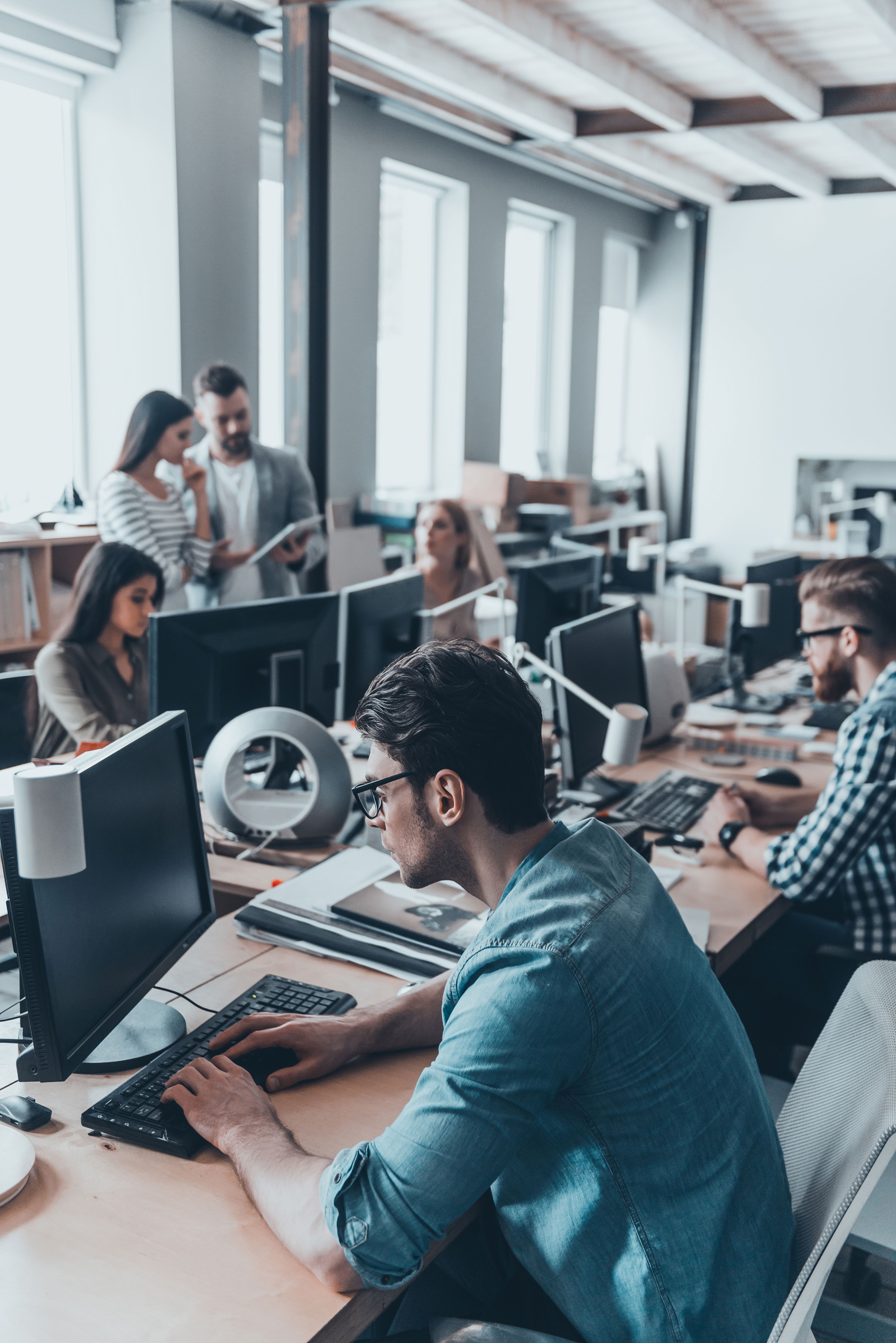 woman walking on street surrounded by buildings