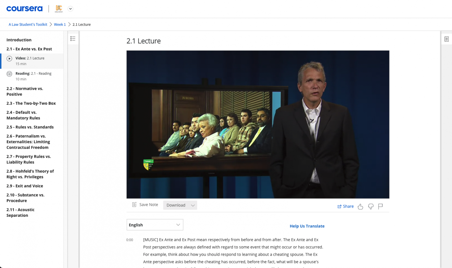 four boys laughing and sitting on grass during daytime