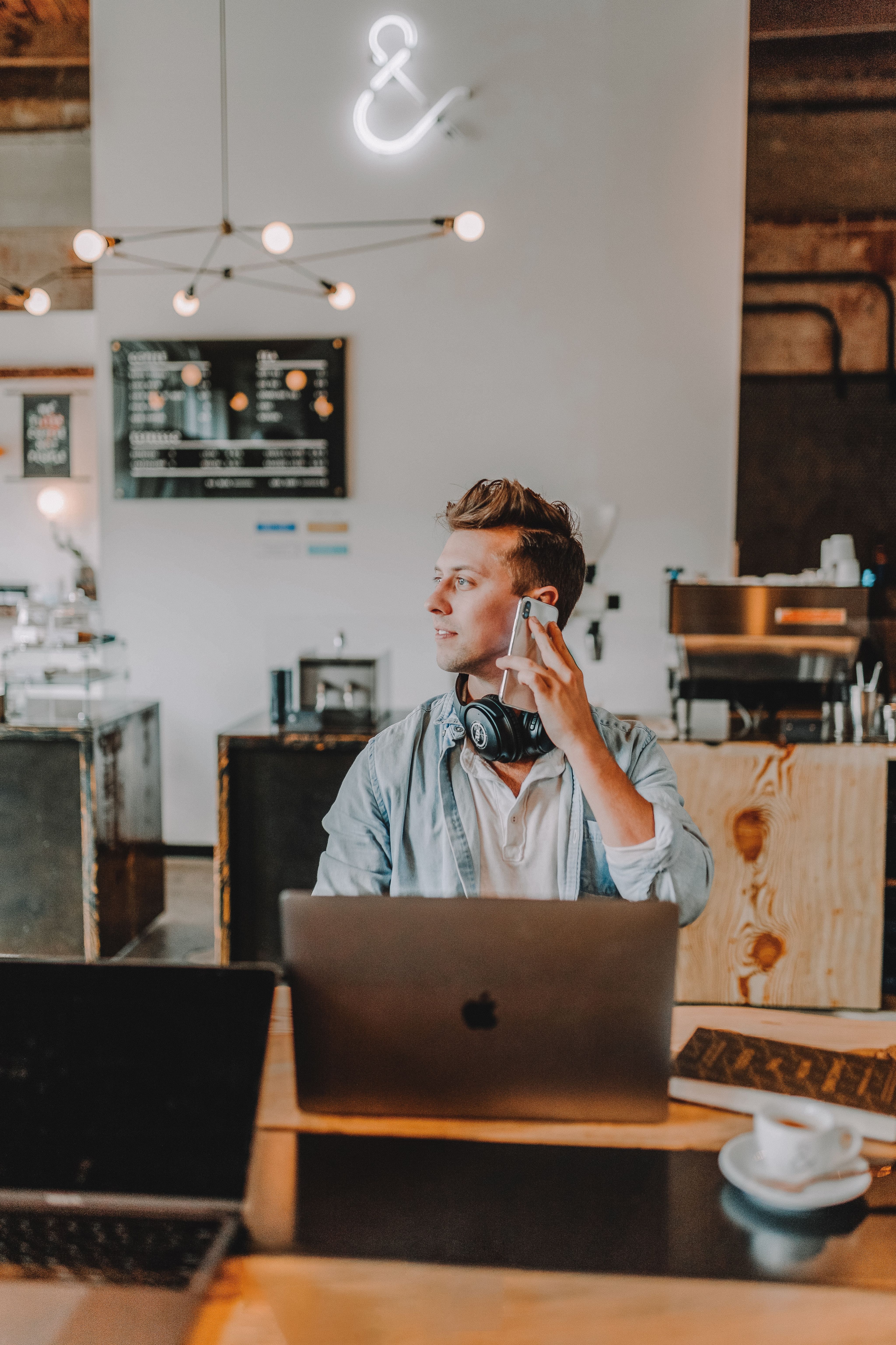 one unknown person holding smartphone wearing blue shirt