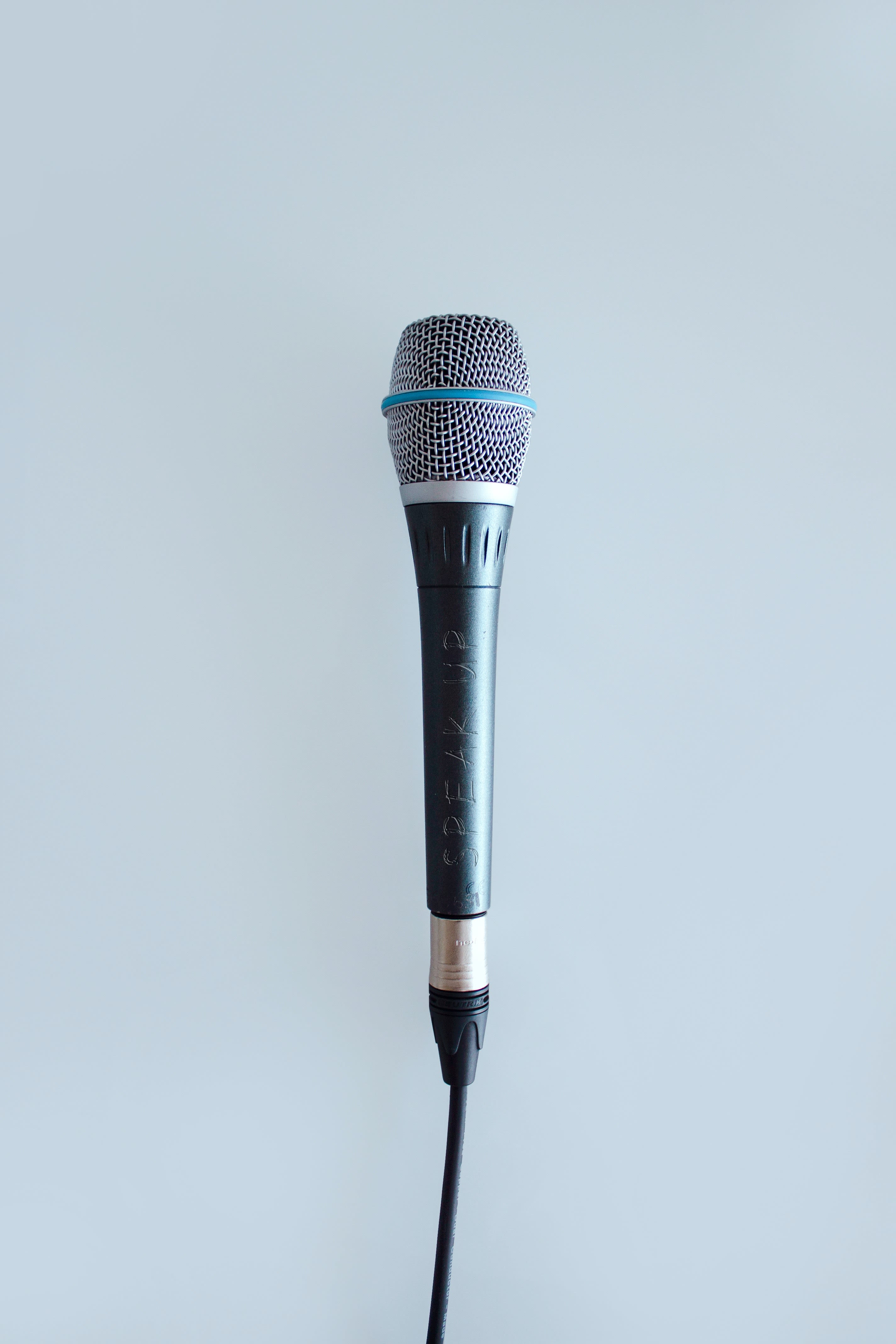 black and gray corded microphone
