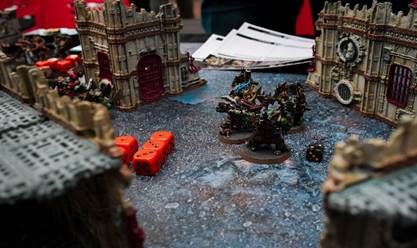 A game board with dice and figures

AI-generated content may be incorrect.