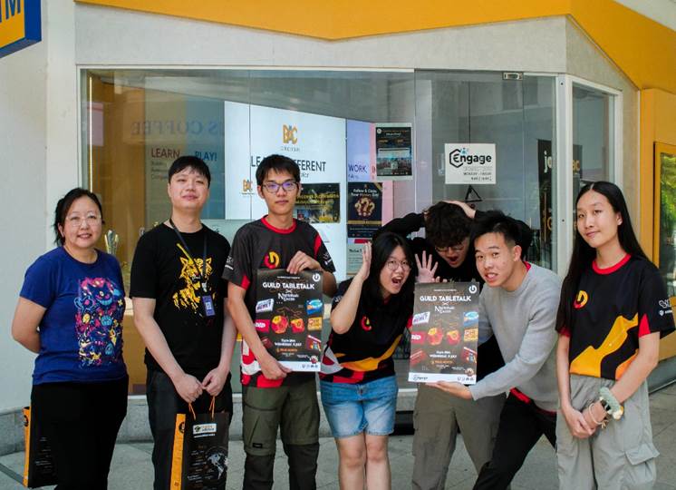 A group of people posing for a photo

AI-generated content may be incorrect.