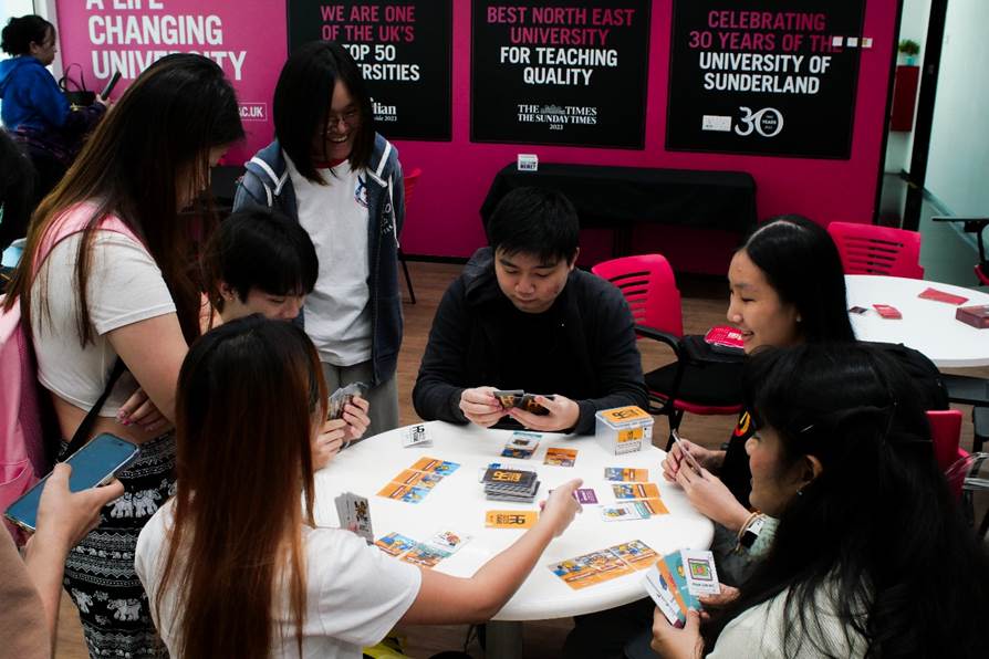 A group of people playing cards
AI-generated content may be incorrect.