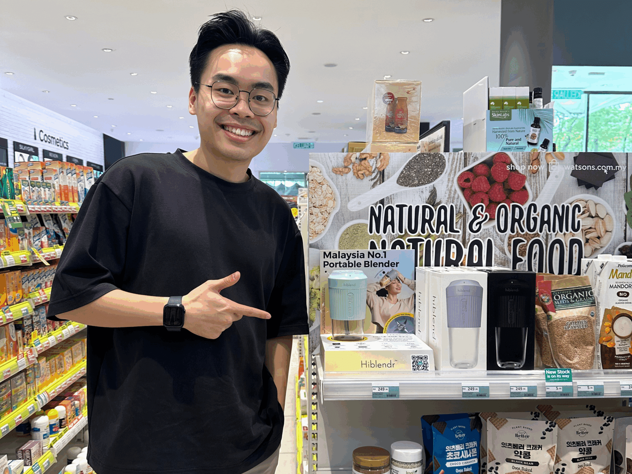 Andrew standing next to HiBlendr products sold in-store at Watson, Malaysia. Source: Seng Yong (Andrew) Poh via Study International