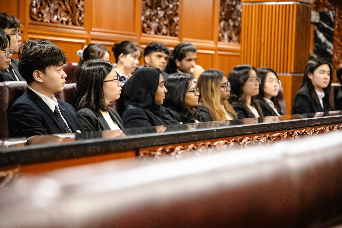 Group of students taking a selfie in a classroom